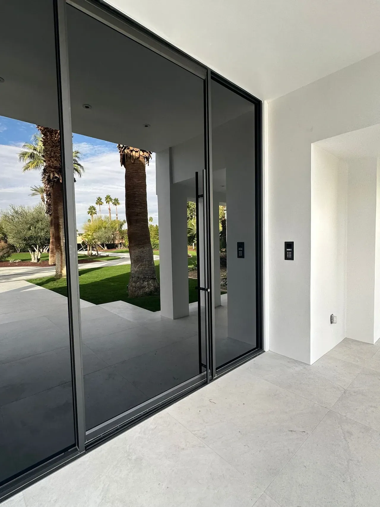 Transform Your Entrance with Glazzworks' Signature Pivot Doors